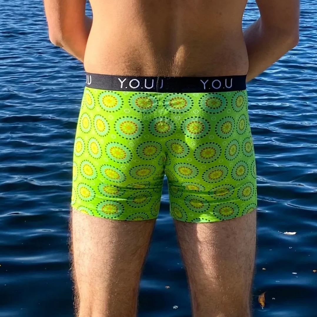 model wearing organic cotton mid length trunks green mara - You Underwear