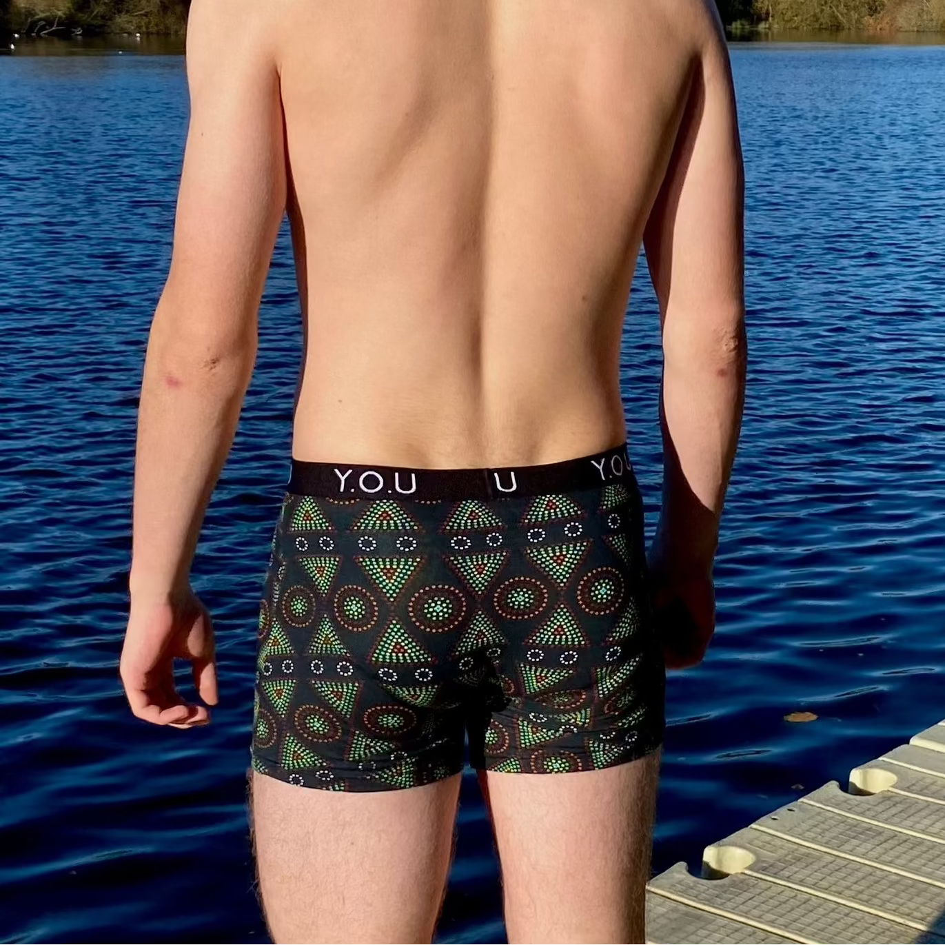model wearing organic cotton mid length trunks black mara - You Underwear