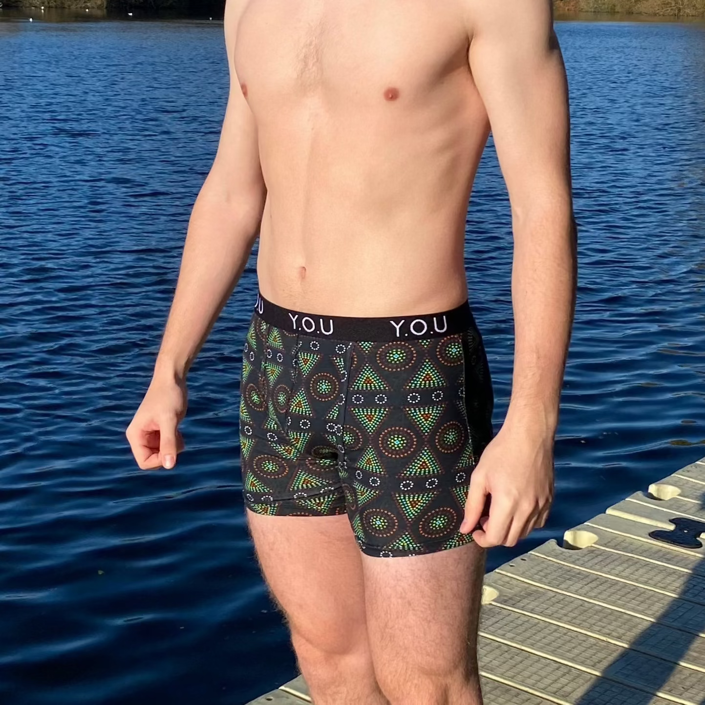 model wearing organic cotton mid length trunks black mara - You Underwear