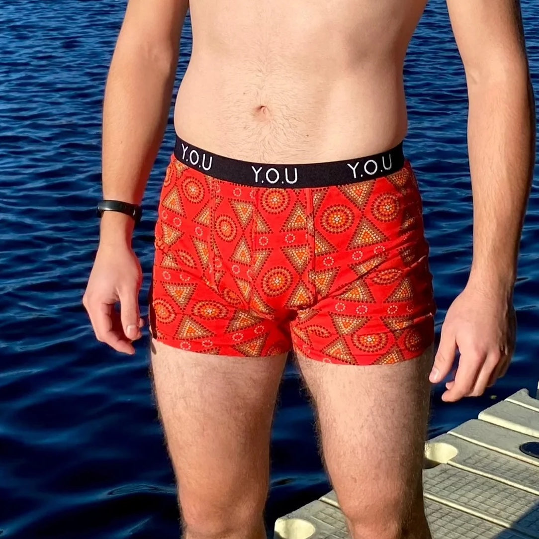 model wearing organic cotton mid length trunks red mara - You Underwear