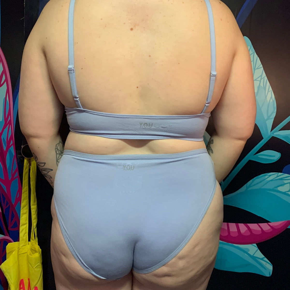 model wearing a light blue organic cotton matching set with a bralette and mid rise bikini knickers - You Underwear