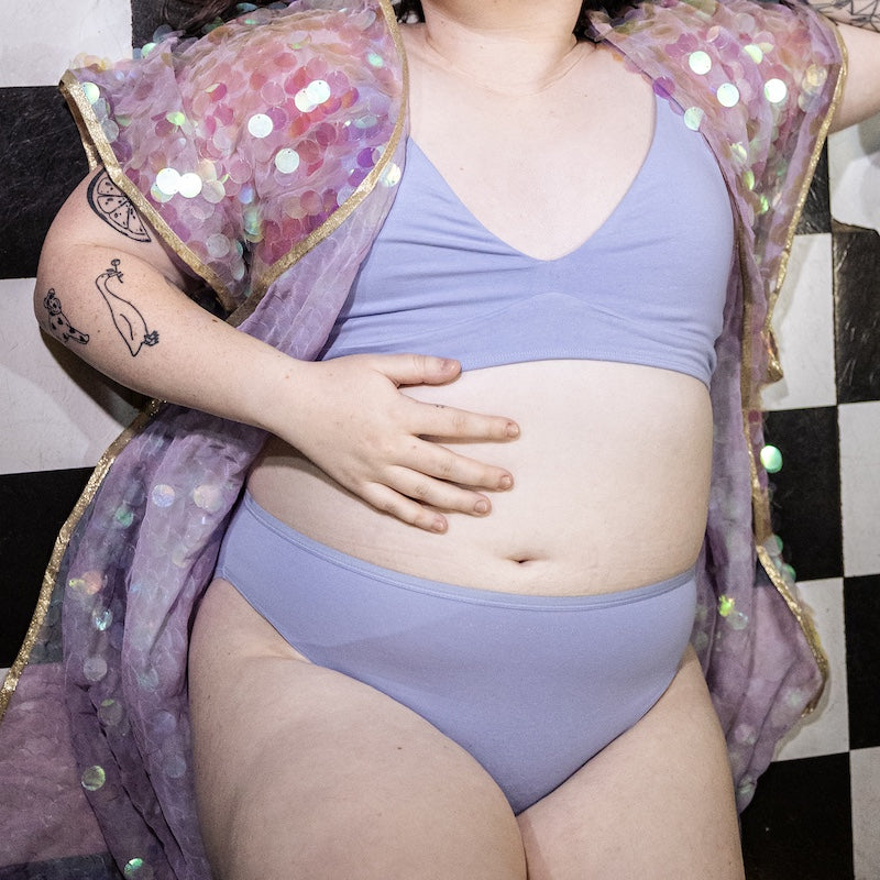 model wearing a light blue organic cotton matching set with a bralette and mid rise bikini knickers - You Underwear