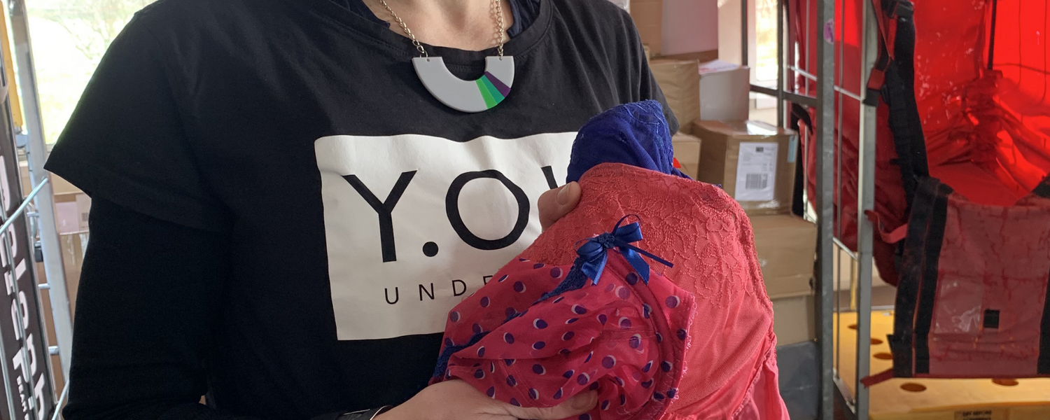 Sarah wears a Y.O.U Underwear T-Shirt and holds some Bras