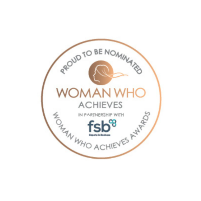 An image which reads,' Proud to be nominated, woman who achieves, in partnership with fsb, woman who achieves awards.' The writing is in black and gold, with a gold circular border around the writing on a white background.