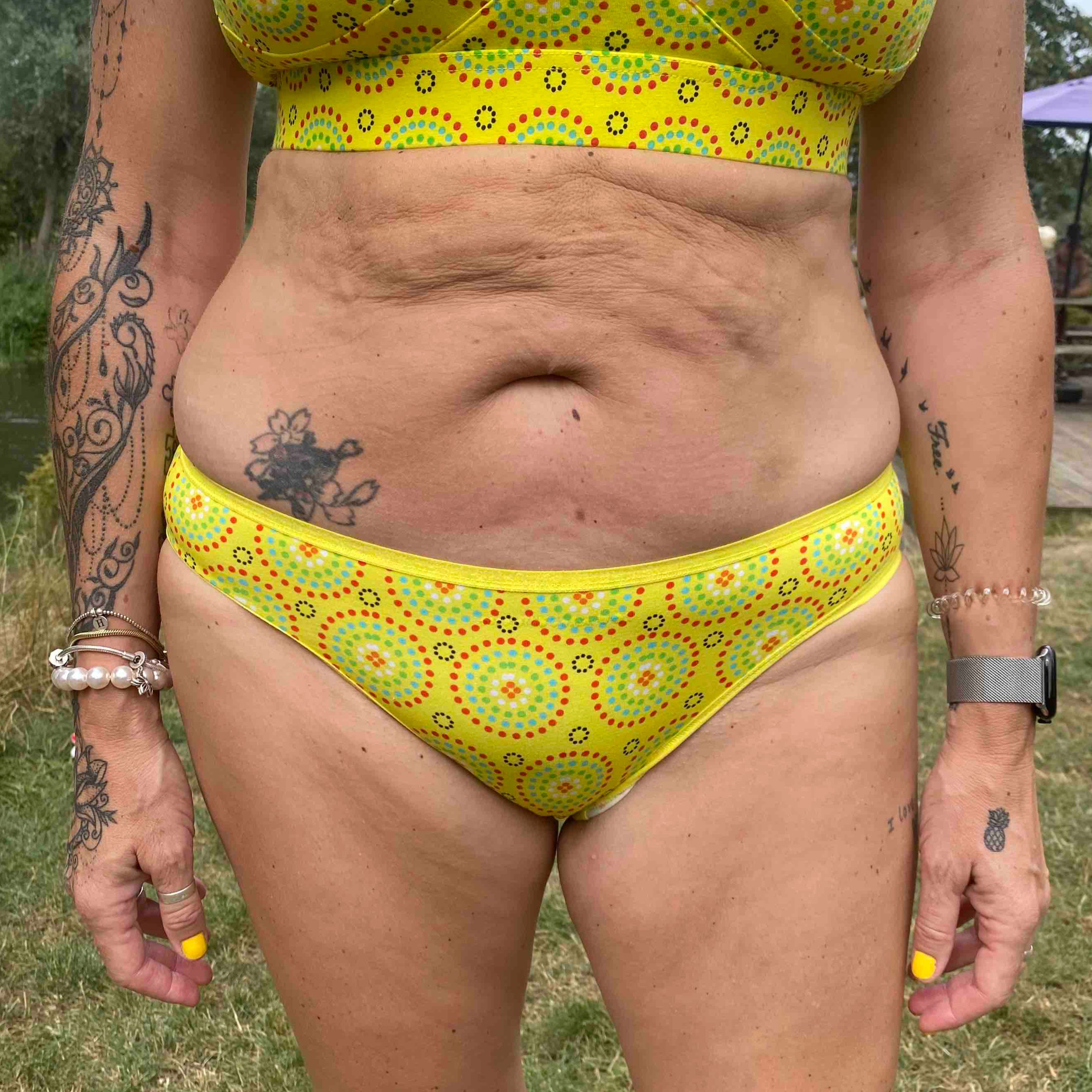 model wearing organic cotton low rise bikini yellow mara print - You Underwear