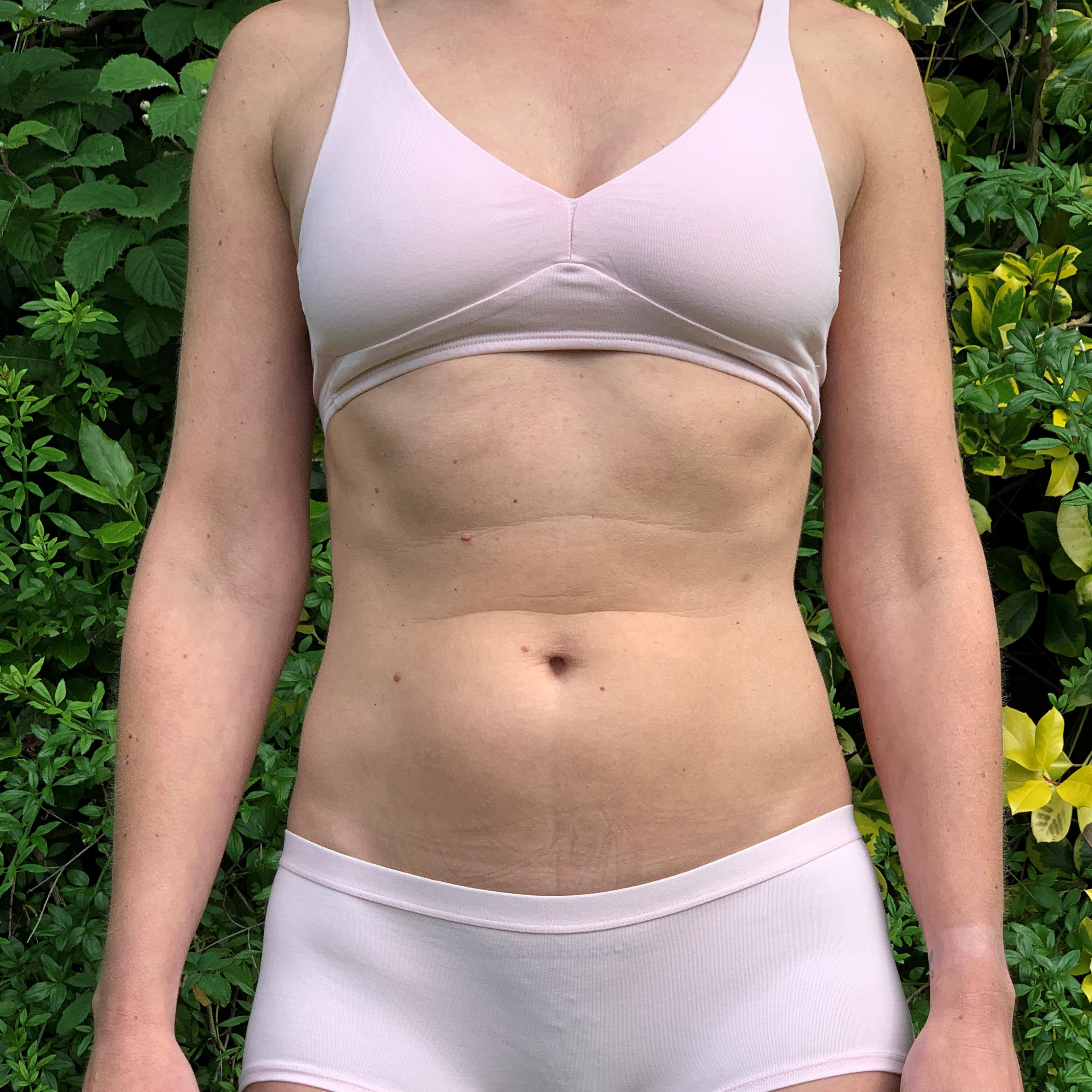 Women's organic cotton matching bralette and boy shorts set in light pink