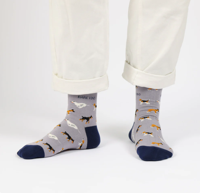 Bare Kind socks - Save the Dogs person standing wearing the socks