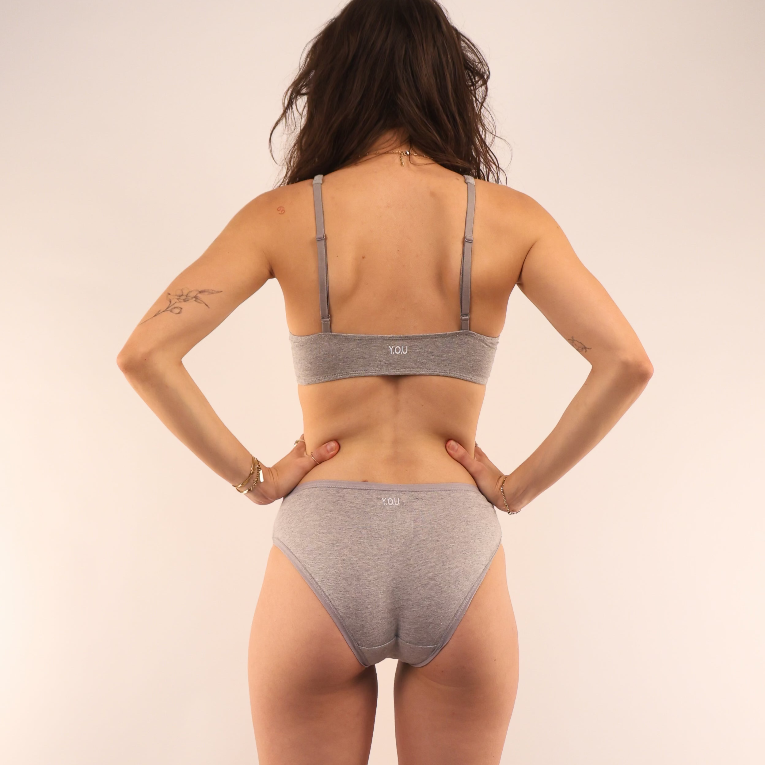 model wearing an organic cotton matching set with a white bralette and low rise bikini- You Underwear