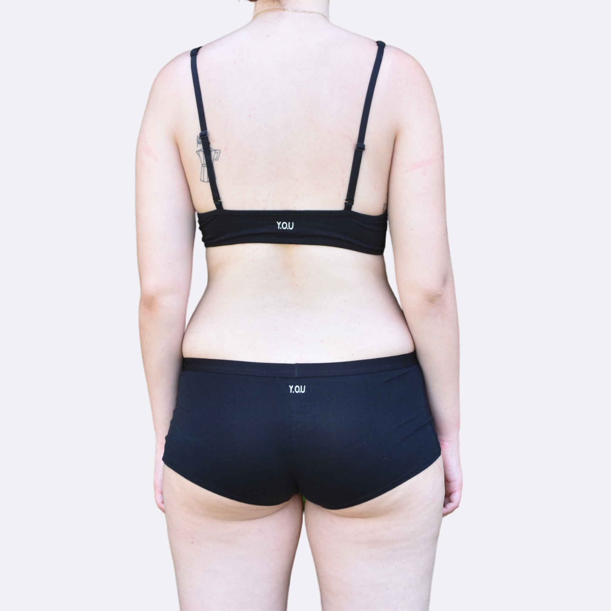 Women's black bralette and plain boy shorts - back view 