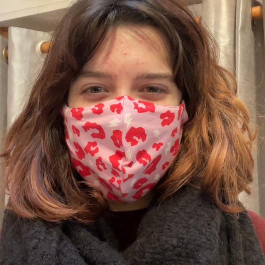 Brunette wearing a pink facemask