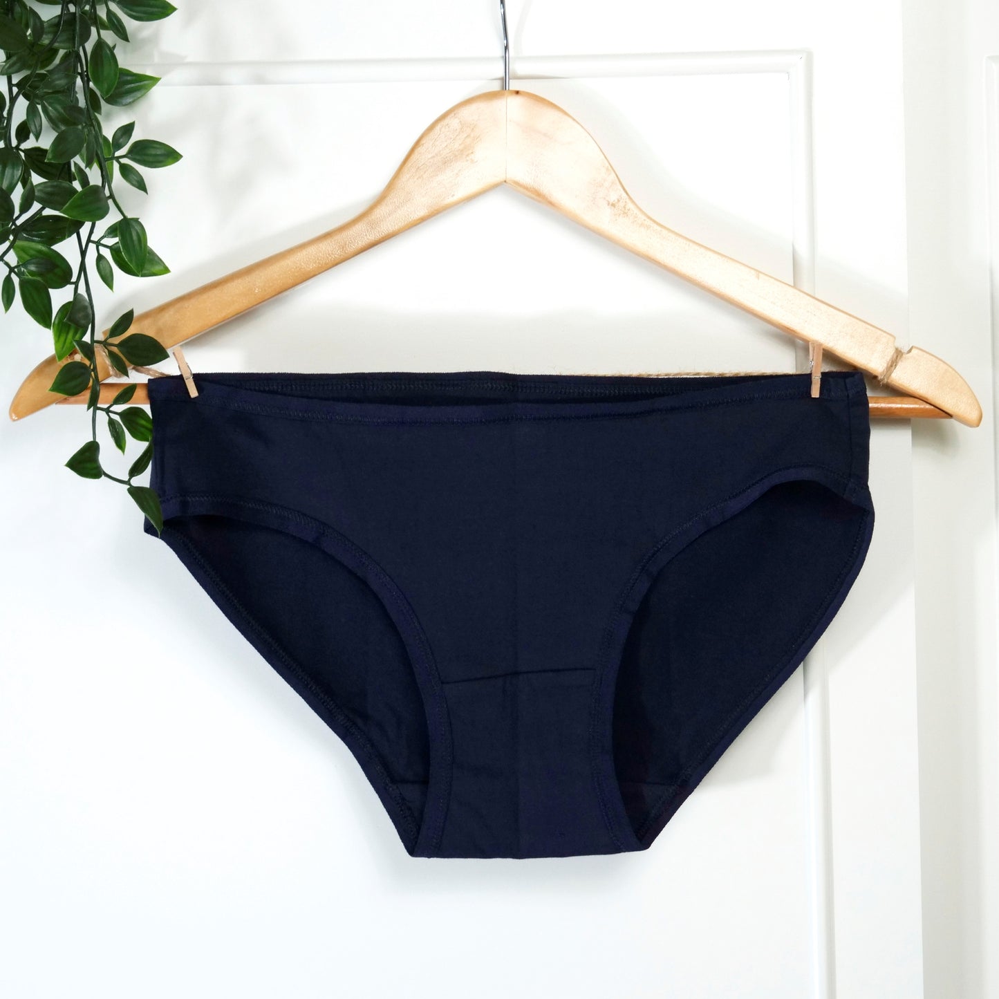 Women’s organic cotton low-rise bikini bottoms in navy blue